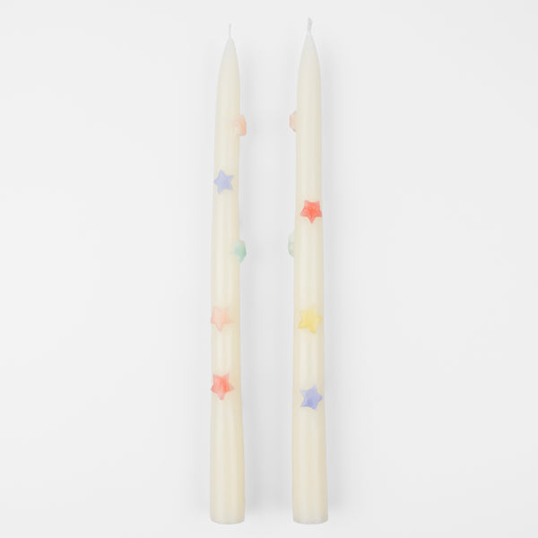 Our taper candles, with colored stars, will look great as table candles or on placed on the mantel.