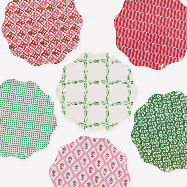 Our Christmas side plates, made from heavyweight paper, feature Molly Mahon block print designs in seasonal colors for a stylish look. Image1