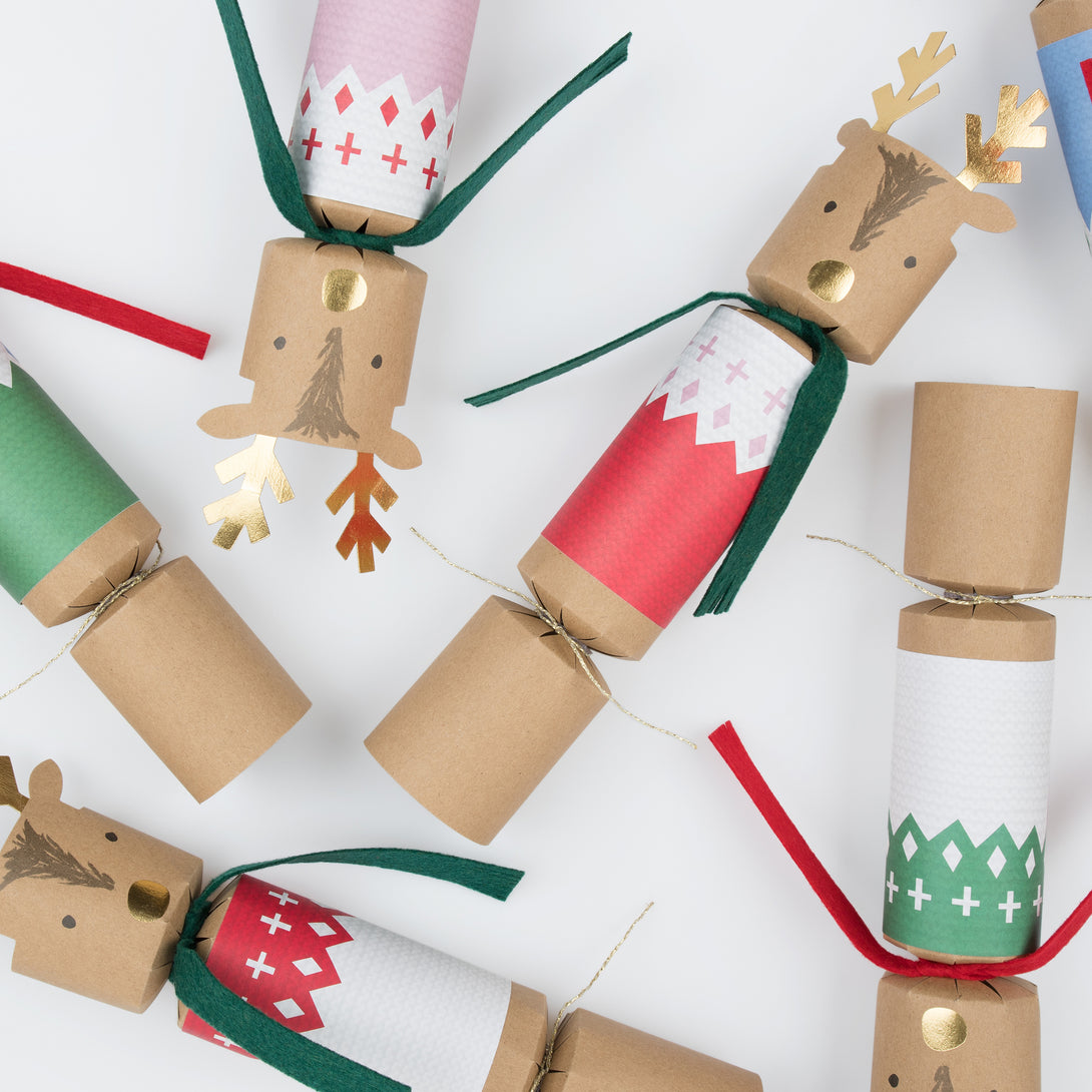 Our luxury Christmas crackers, with an adorable reindeer design, each contain a party hat, joke and a Christmas eraser or reindeer brooch.