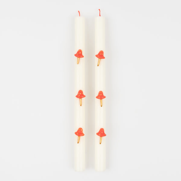 Our Christmas candles, with red and gold mushroom details, have fun red wicks and are perfect as Christmas table decorations. Image3