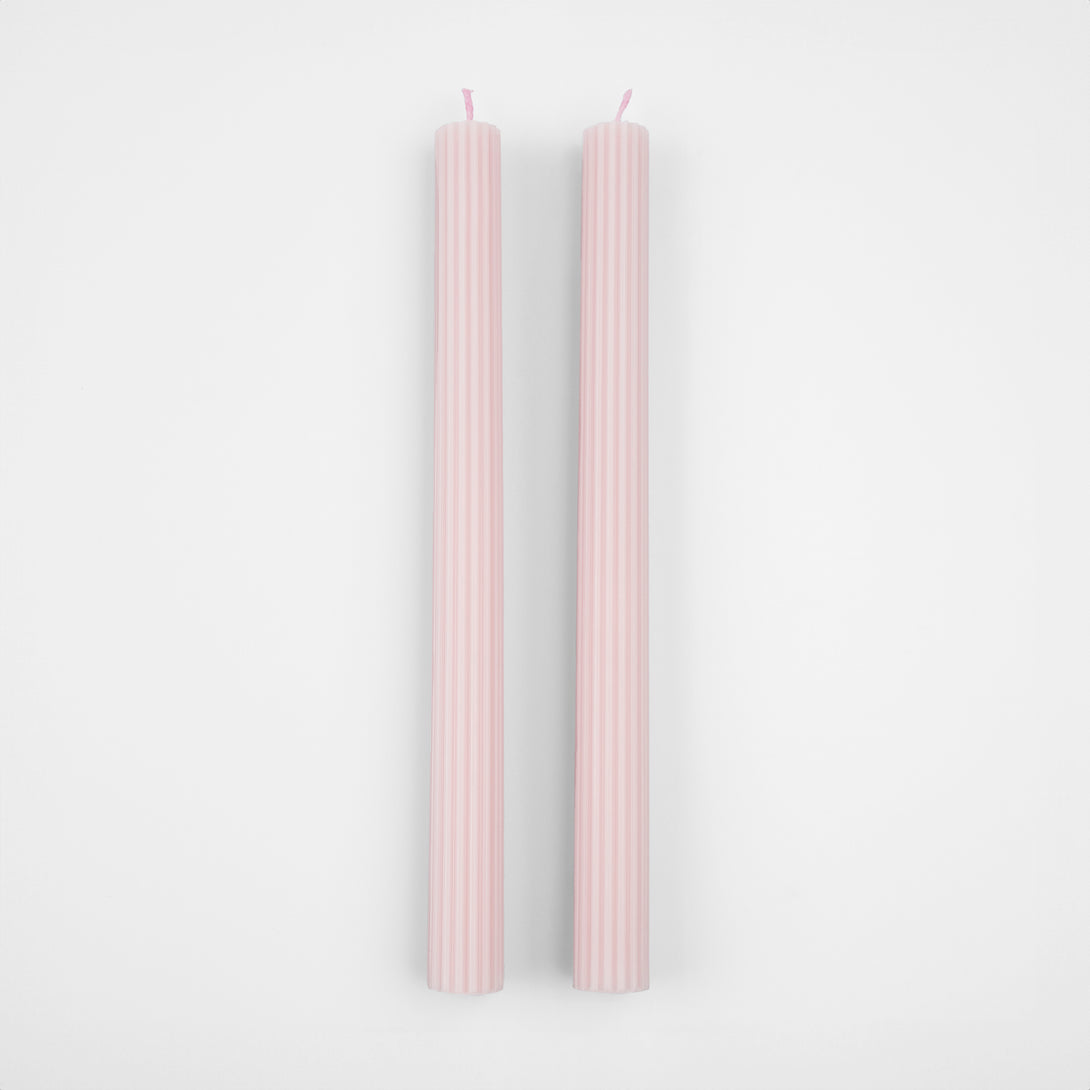 Our tall candles, in a pink color with ridged details, add a stunning look to any party.