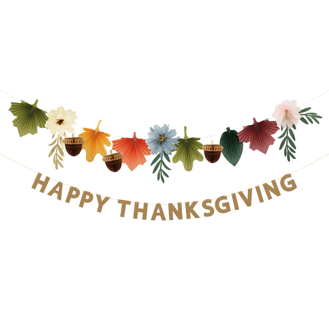 Our Thanksgiving garland has the perfect mix of fall leaves, paper flowers and the words Happy Thanksgiving.