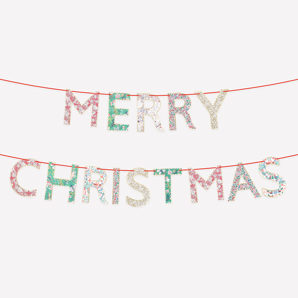 Our paper Merry Christmas garland features joyful festive Liberty prints and red velvet ribbons for an elegance and style. Image1