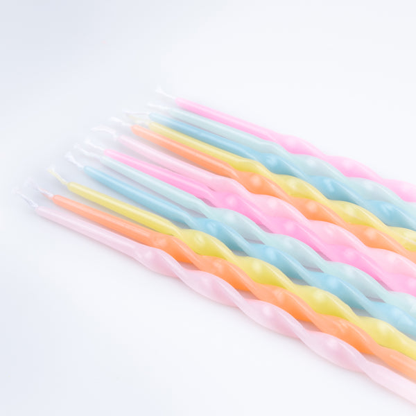 Our party candle set features pastel candles, in a twisted shape, packaged in a box with a Liberty print design. Image2