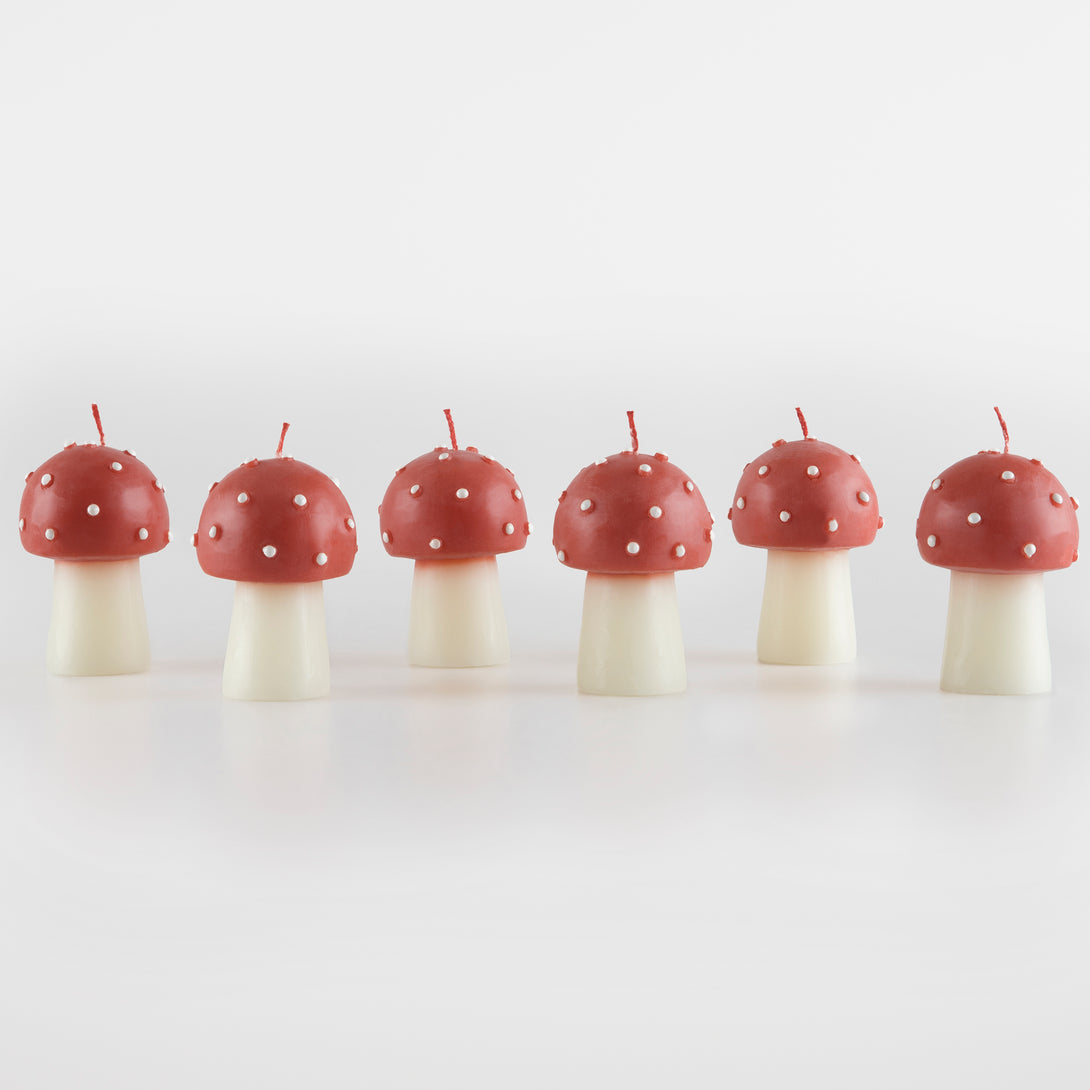 Our Christmas candles, are shaped like little mushrooms, in red and white with red wicks.