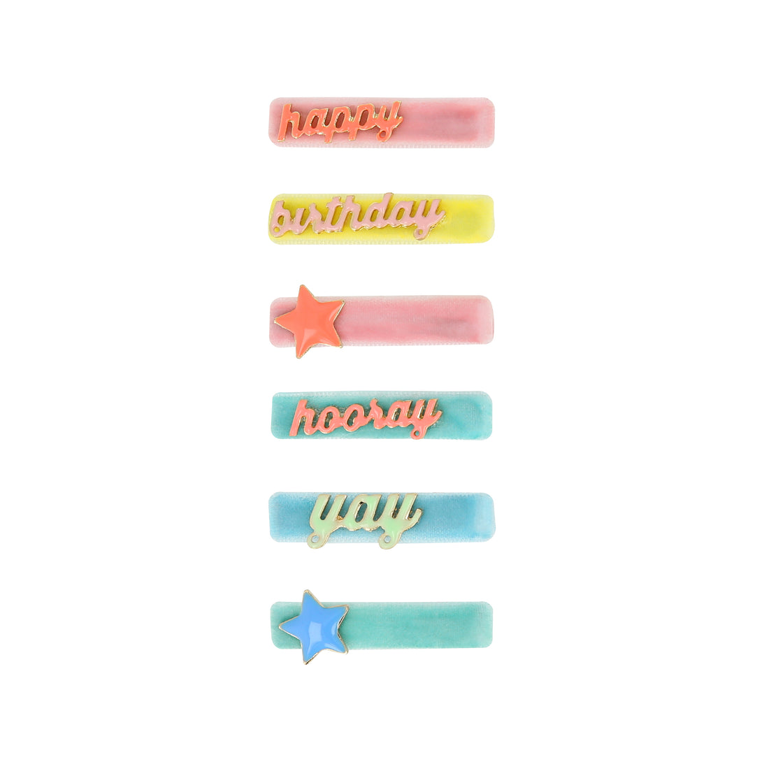 Our hair accessories for kids are charming birthday candle shaped clips with velvet ribbon and enamel details.