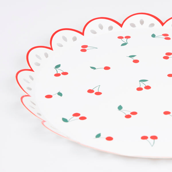 Our white and red paper plates feature a cherry design and eyelet embroidery feel, perfect for a summery look. Image3