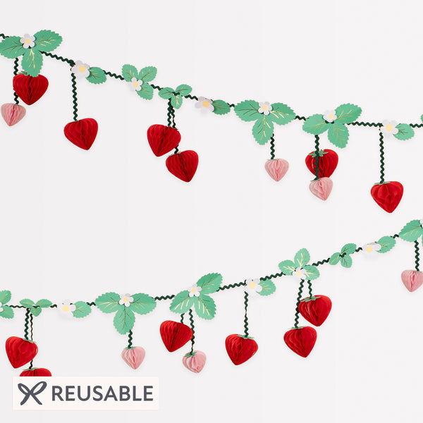 Our party garland has 3D strawberry pennants, with flowers, leaves and green ricrac ribbons, great as summer party decor. Image1