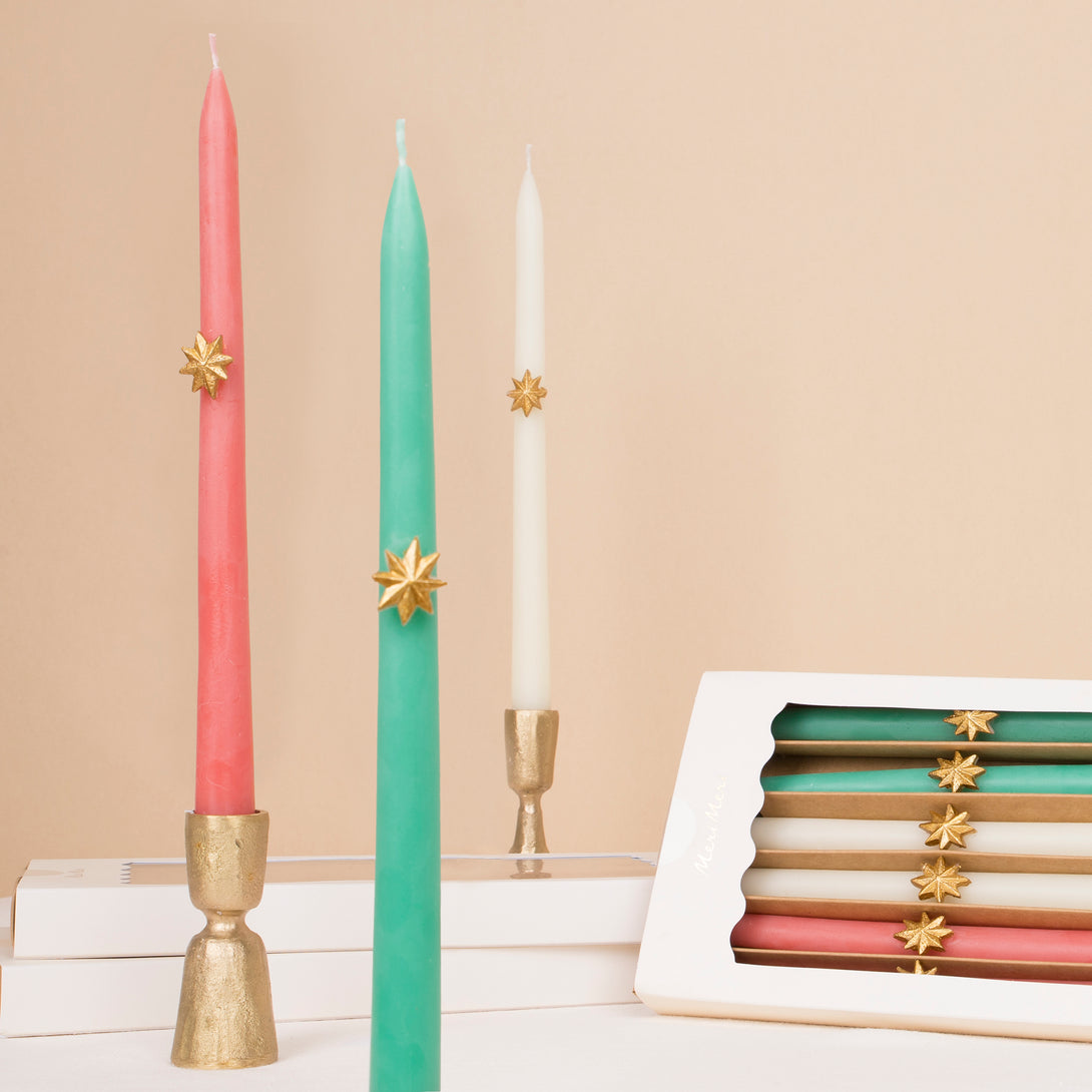 Our Christmas tall candles features gold wax stars and colored wicks for a sensational effect, a great host gift.