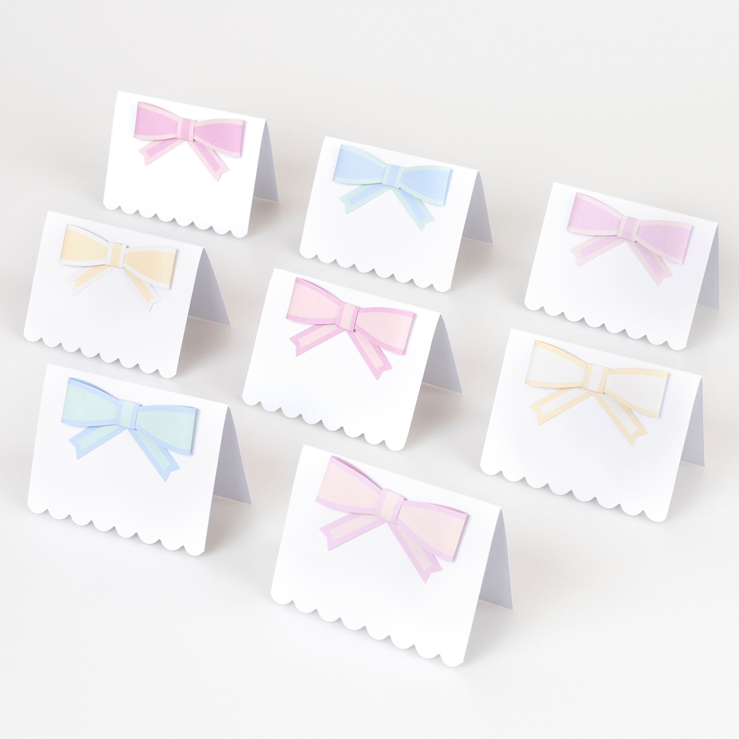 The pastel bows on our paper name place cards give a stunning look.