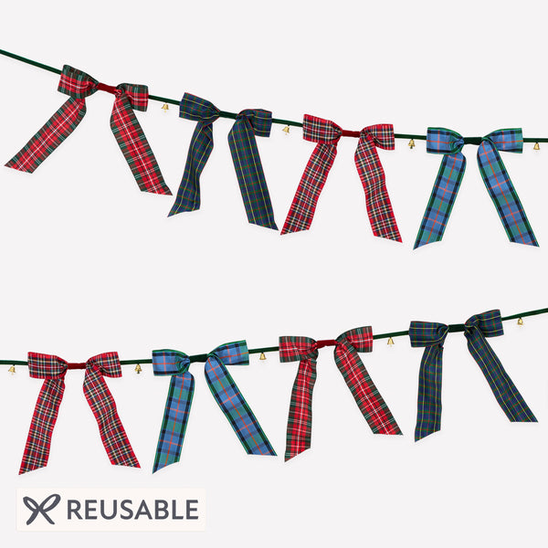 Our statement Christmas garland features large plaid bows with tinkling bells, perfect for hanging wherever you want seasonal sophistication. Image1