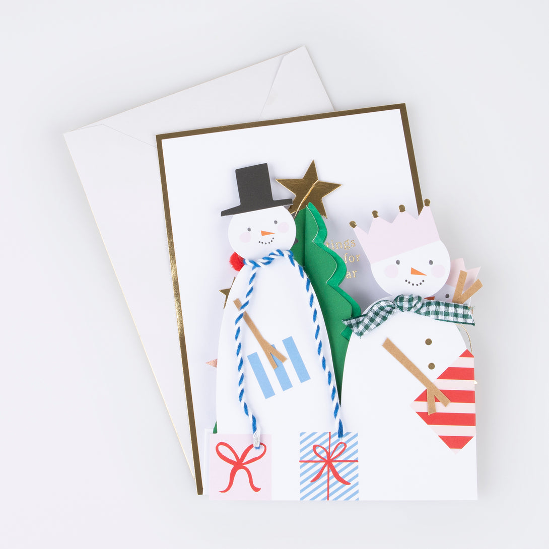 Our snowman card has lots of special embellishments, a 3D Christmas tree and a shiny mini garland, perfect as a Christmas decoration.