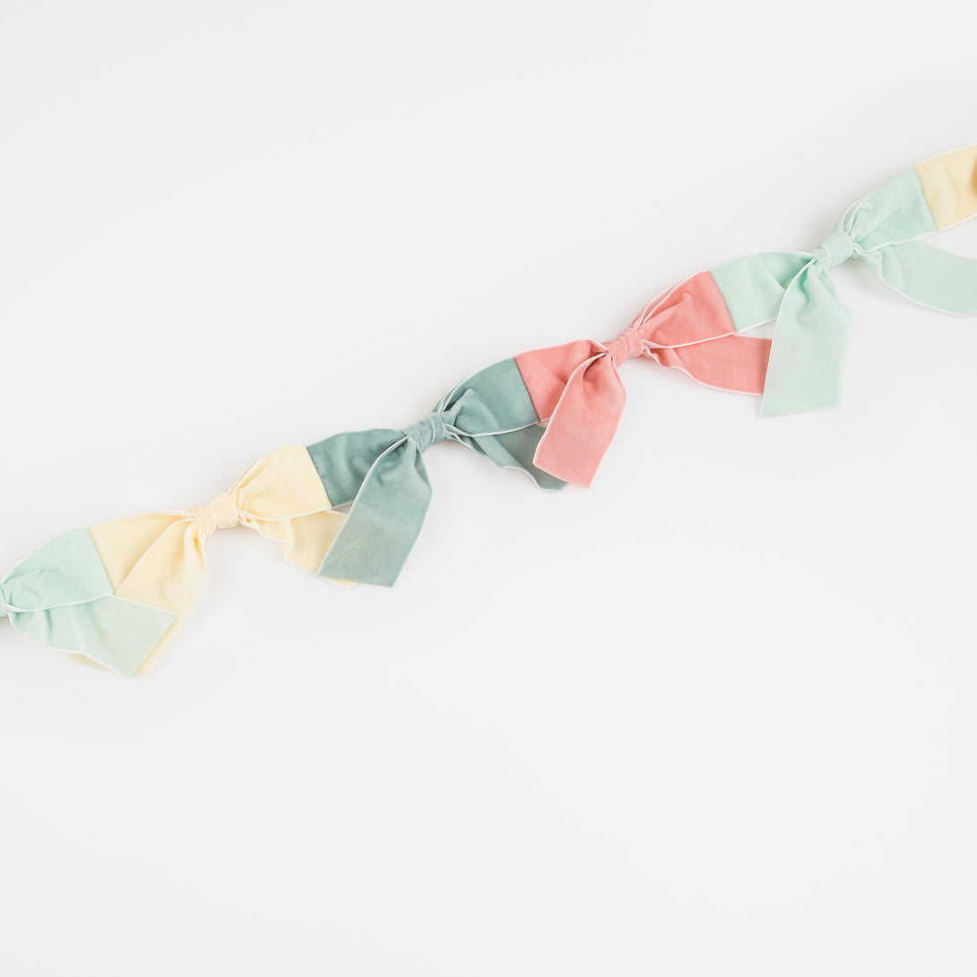 Our velvet bow fabric garland makes a special hanging decoration for a baby shower or bridal shower.