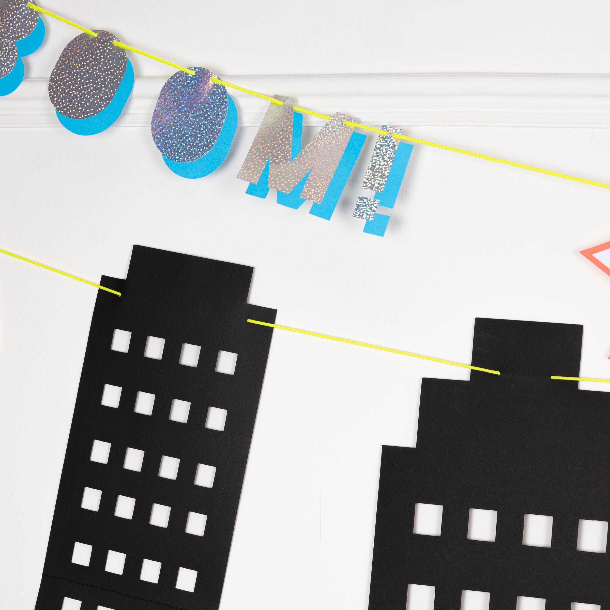 This colorful party garland is ideal for superhero party decorations.