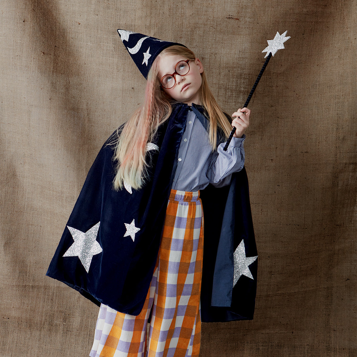 This wizard cape, wizard hat and star wand set, crafted from blue velvet and silver glitter fabric, is a fabulous costume for boys.