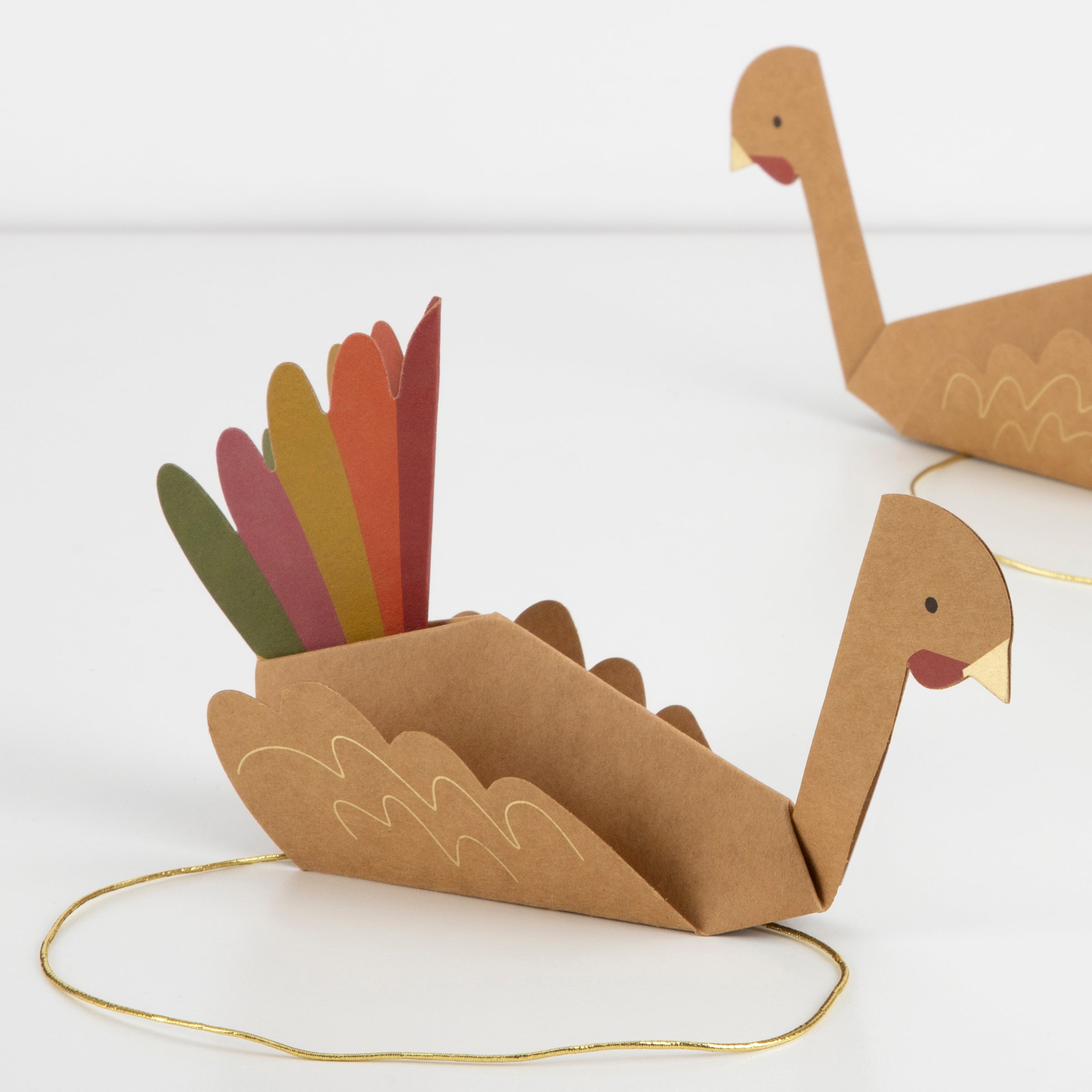 Colorful turkeys, crafted from paper, made the most wonderful Thanksgiving hats.