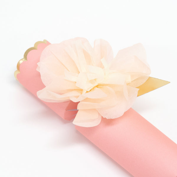 These pretty pink crackers are decorated with tissue paper flowers, and contain a tiara and sparkling glitter brooch. Image5