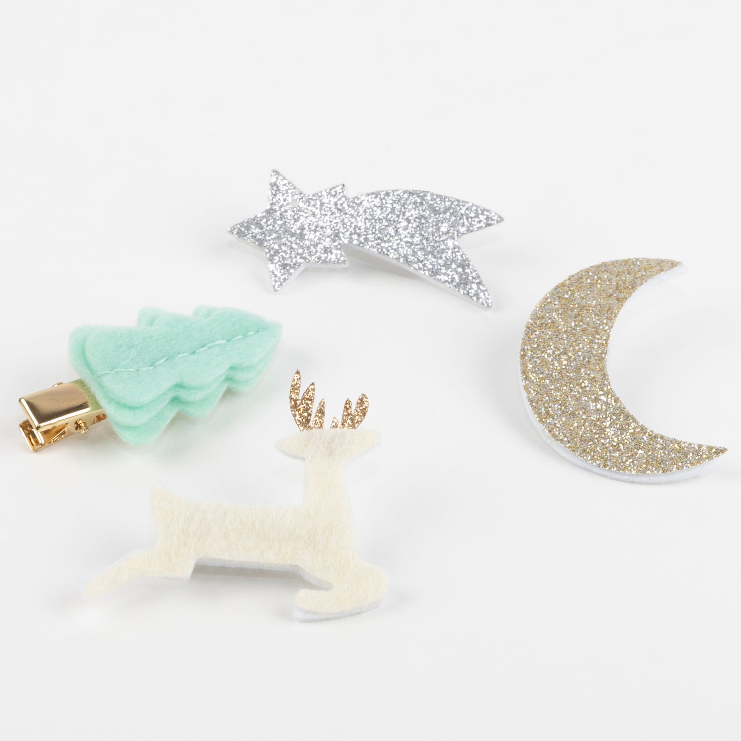Our Christmas hair clips are crafted from felt and glitter.