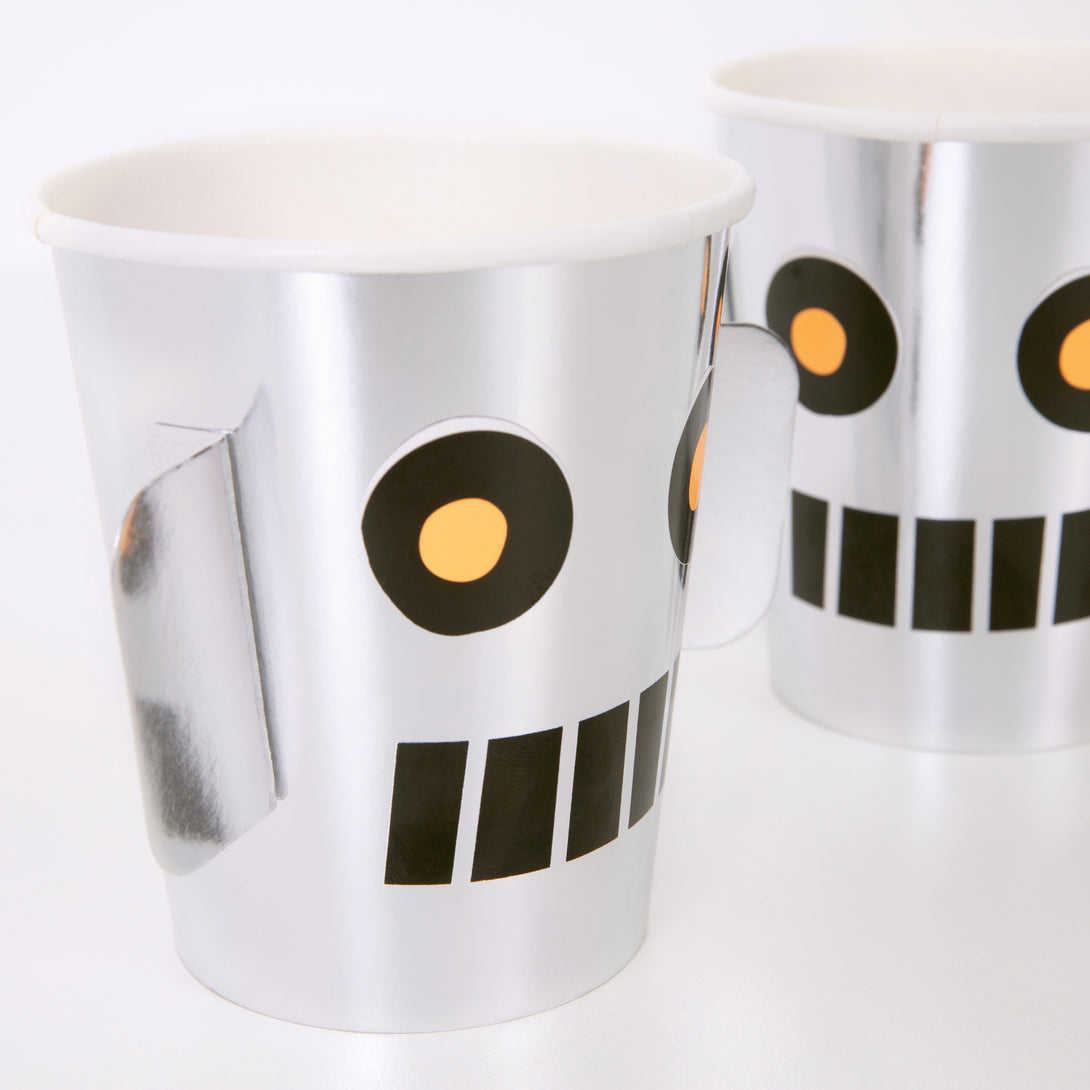 These delightful party cups feature 3D ears and a robot face, the shiny silver cups will look great at a space birthday party.