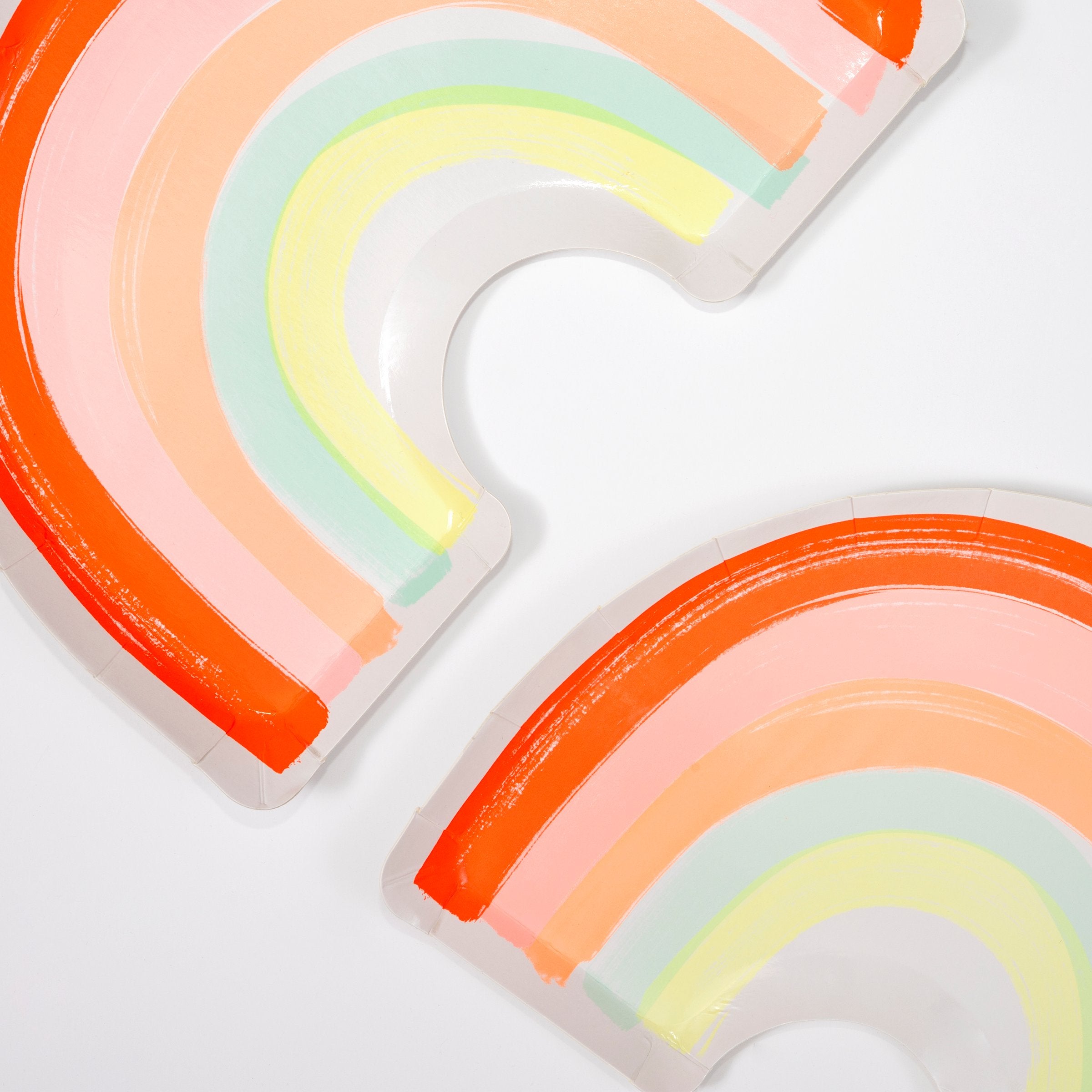 These paper plates are crafted in the shape of a rainbow with lots of bright neon colors.