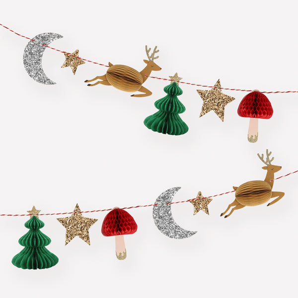 Our Christmas party garland features honeycomb details and lots of glitter for a fabulous Christmas wall decoration.