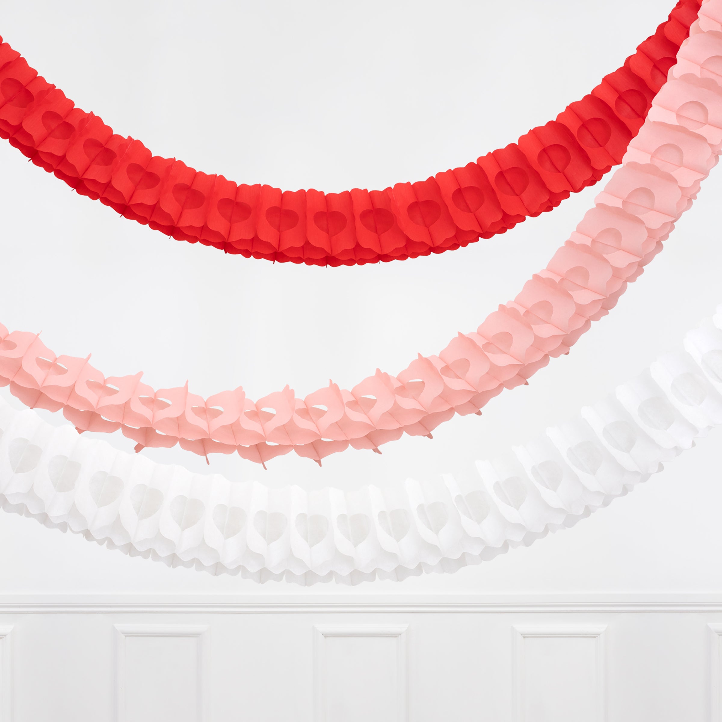 Our large hanging Christmas decorations, three honeycomb garlands in red, white and pink, look amazing.