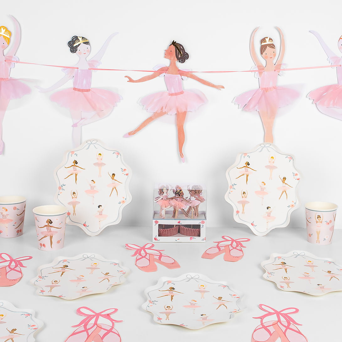 This set includes ballerina decorations for a birthday party, and tableware and a cupcake kit.