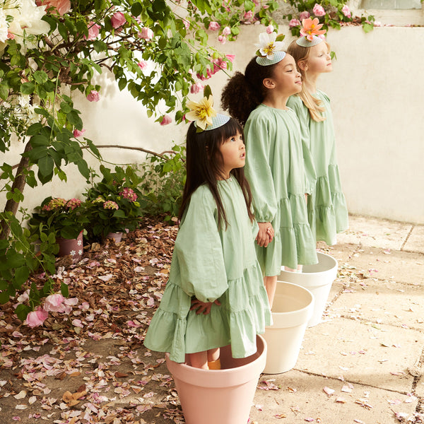 Our fabulous paper hats, with a large flower design and on trend green gingham details, are the perfect kids party hats. Image2