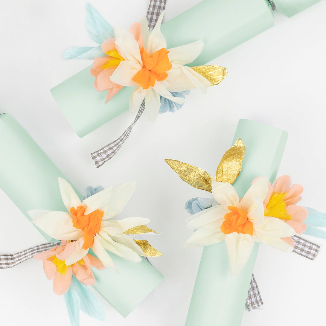 Our Easter crackers are decorated with beautiful crepe paper flowers and contain glitter flower brooches.