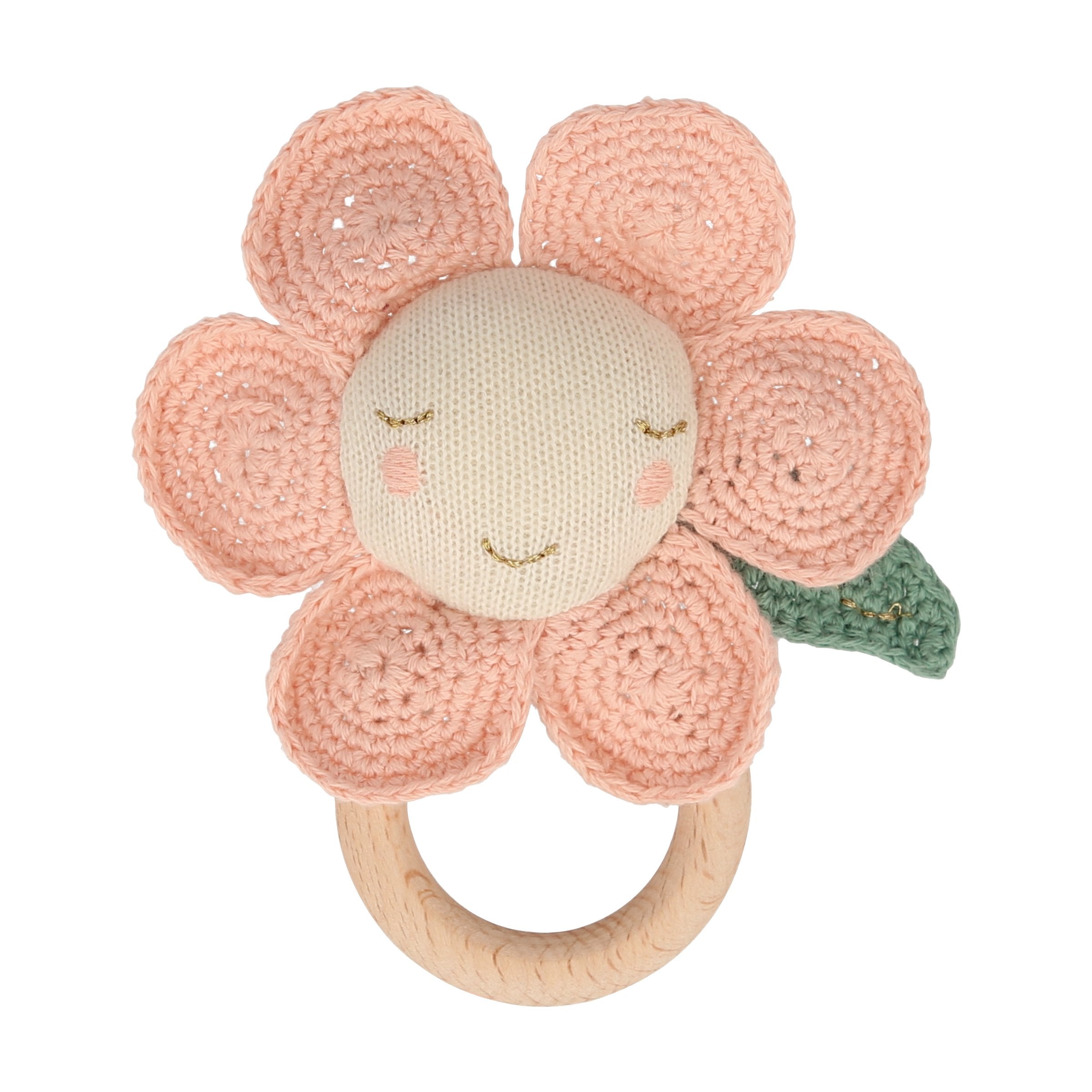 This adorable daisy baby rattle is crafted from knitted organic cotton, with a wooden grip ring and soft noise rattle