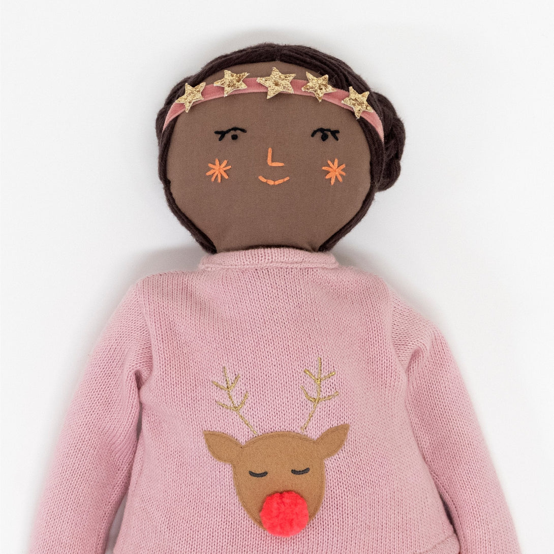 Our Christmas doll comes wearing wonderful doll clothing, including a reindeer sweatshirt.