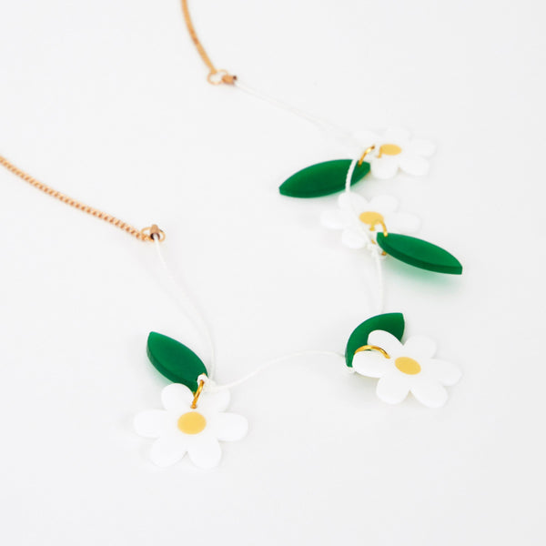 Our colorful daisy necklace is crafted from acrylic with a gold tone chain. Image3