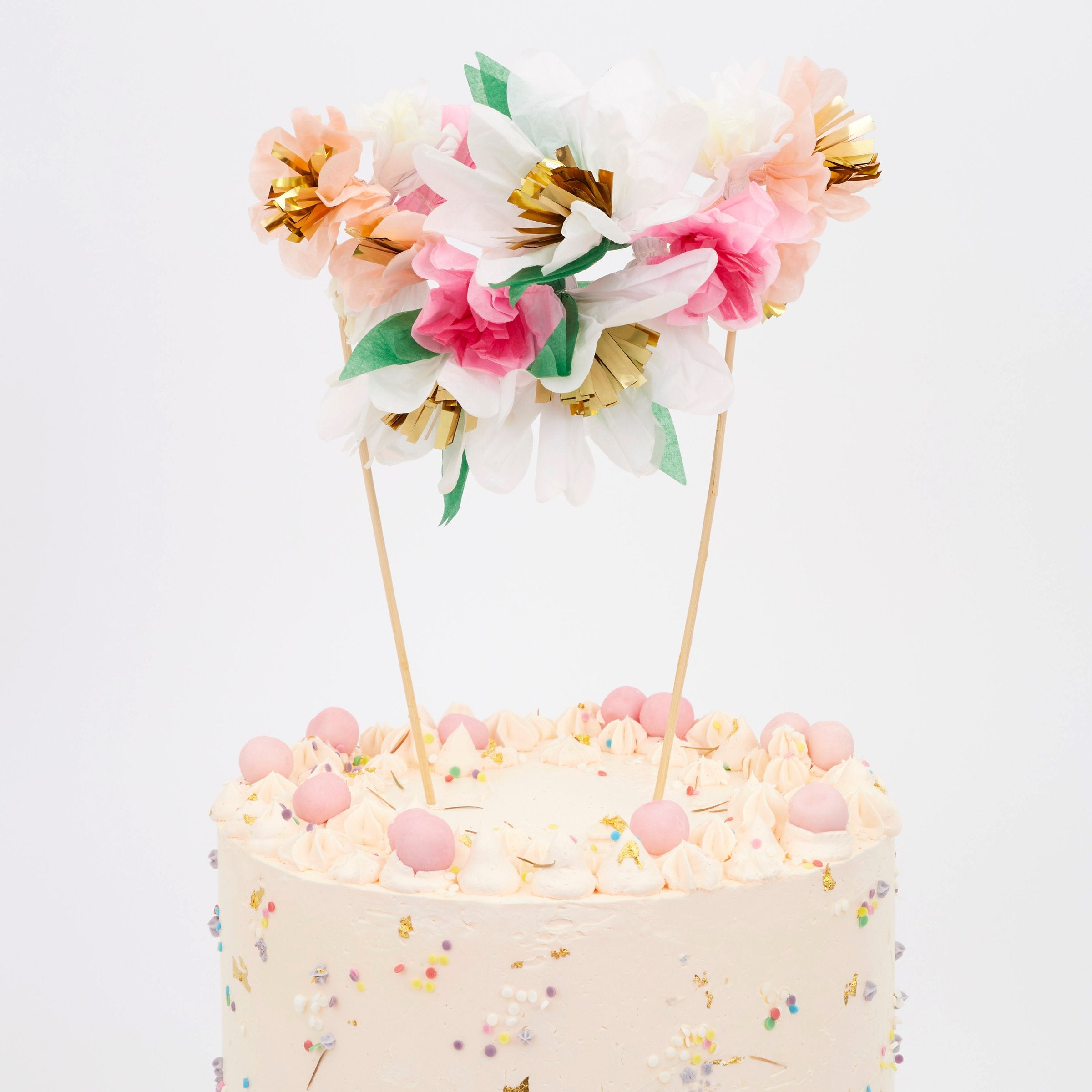 Turn a celebratory cake into a beautiful floral work of art with our fabulous cake topper crafted with colorful paper flowers.