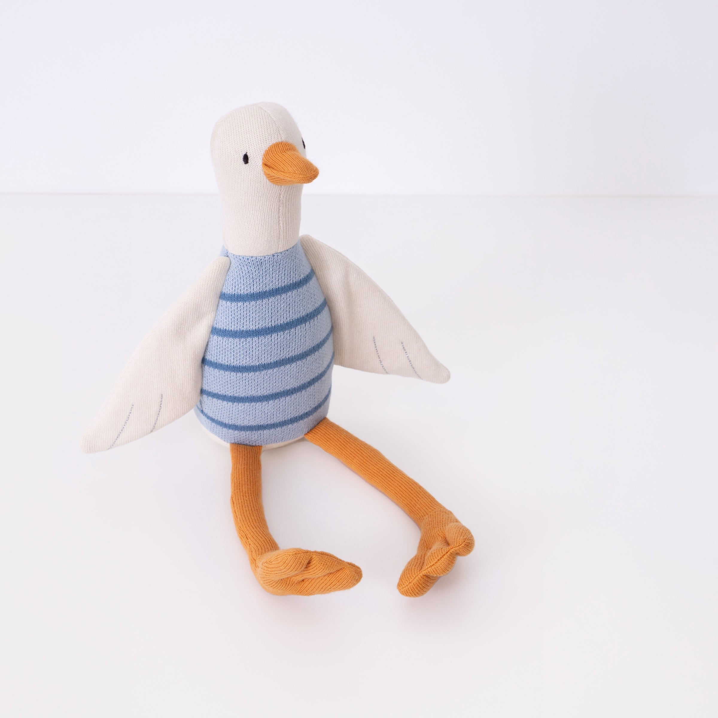 This adorable duck soft toy is an organic cotton toy, with sweet details.