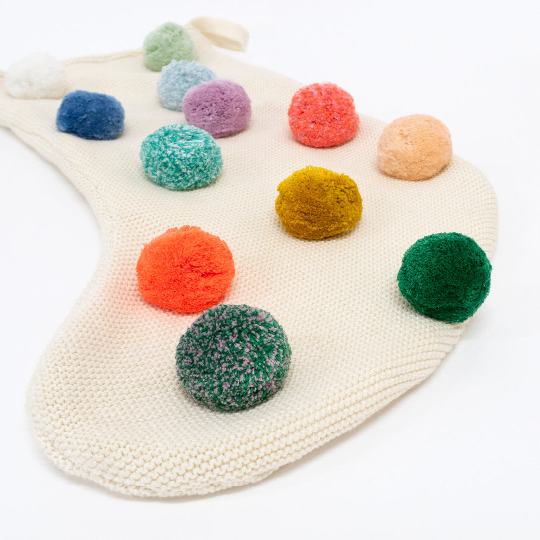 Colorful pompoms make this a fabulous fun kids' Christmas stocking.