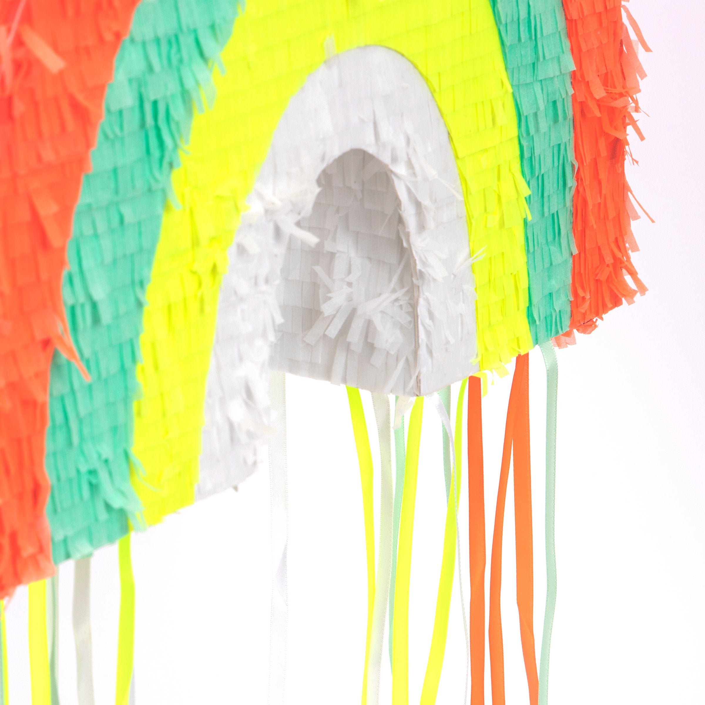 This rainbow pinata is beautifully decorated with colorful stripes and hanging ribbons.