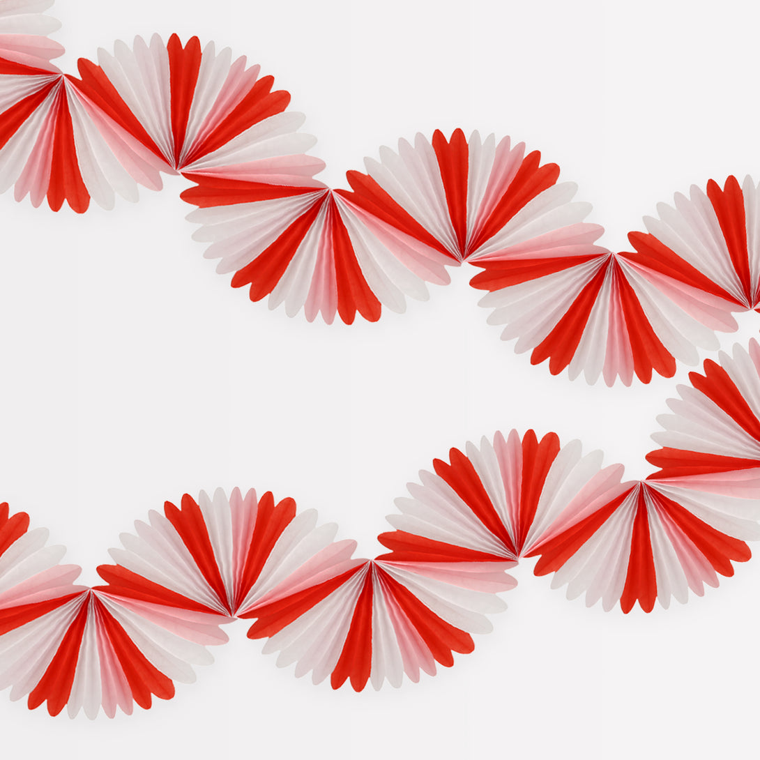 Our honeycomb garland is designed to look like a candy cane decoration, perfect to add to your Christmas party supplies.