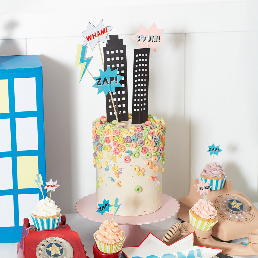 Make special birthday cupcakes with our kit , including cupcake cases and cake toppers, designed for a superhero party.