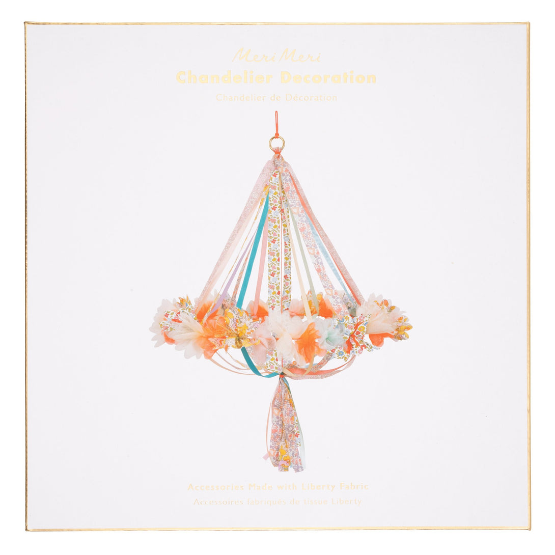 This hanging flower decoration is made from colorful fabric with streamers.