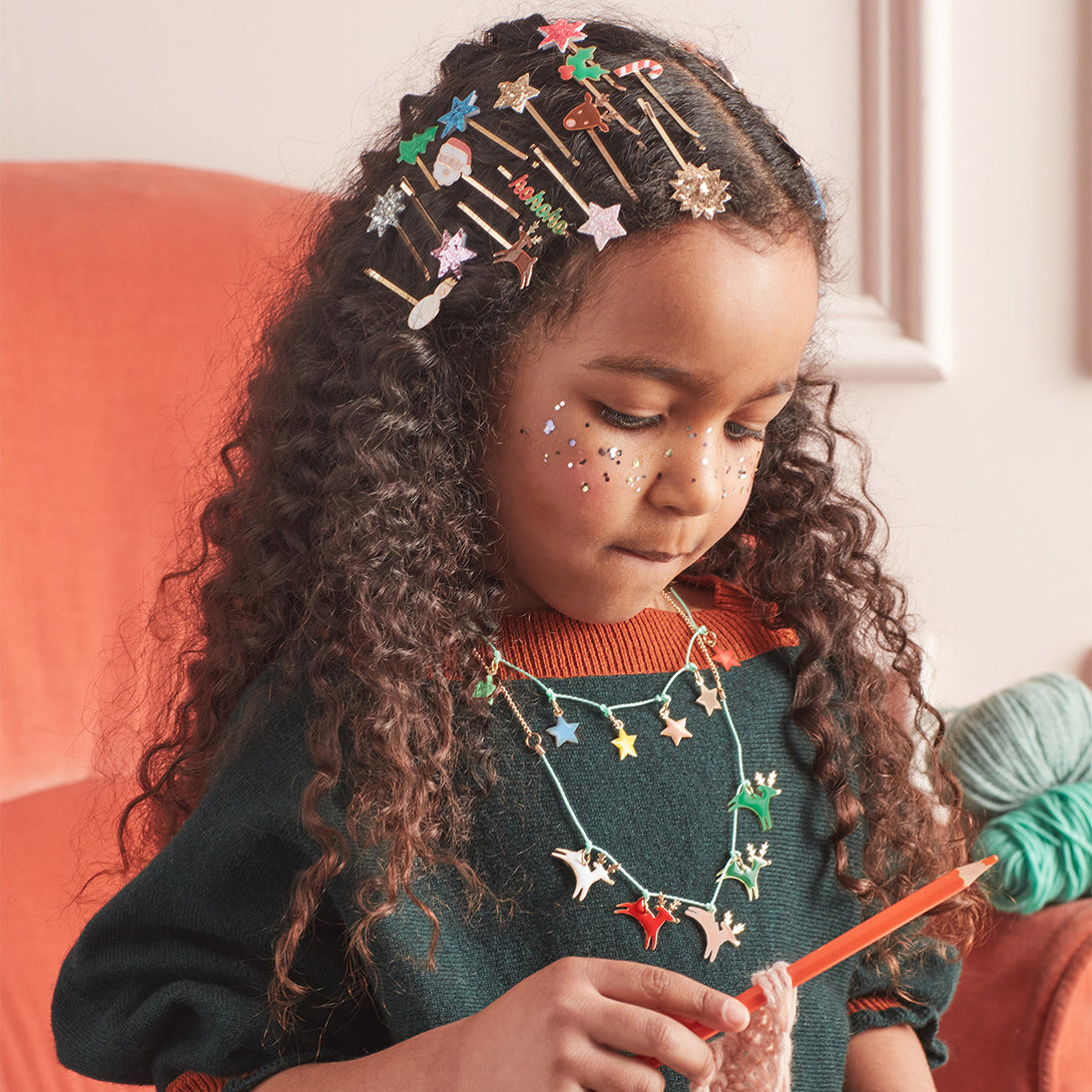 This Christmas necklace, crafted with enamel reindeers, is a wonderful kids stocking filler.