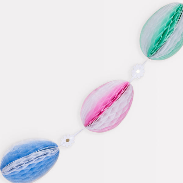 For a decorative Easter go no further than our honeycomb garland with striped Easter eggs and daisy decorations. Image3
