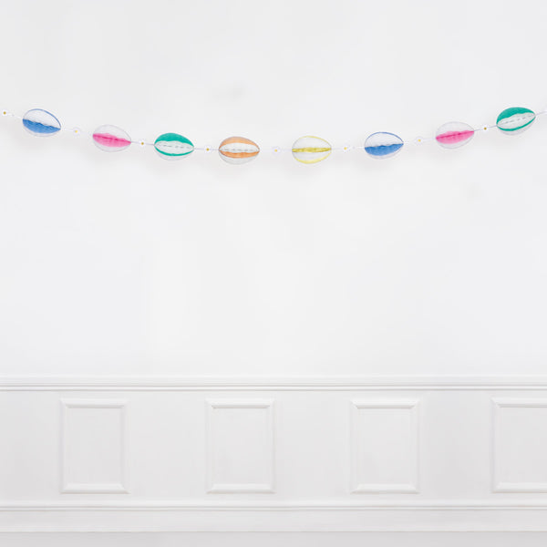 For a decorative Easter go no further than our honeycomb garland with striped Easter eggs and daisy decorations. Image4