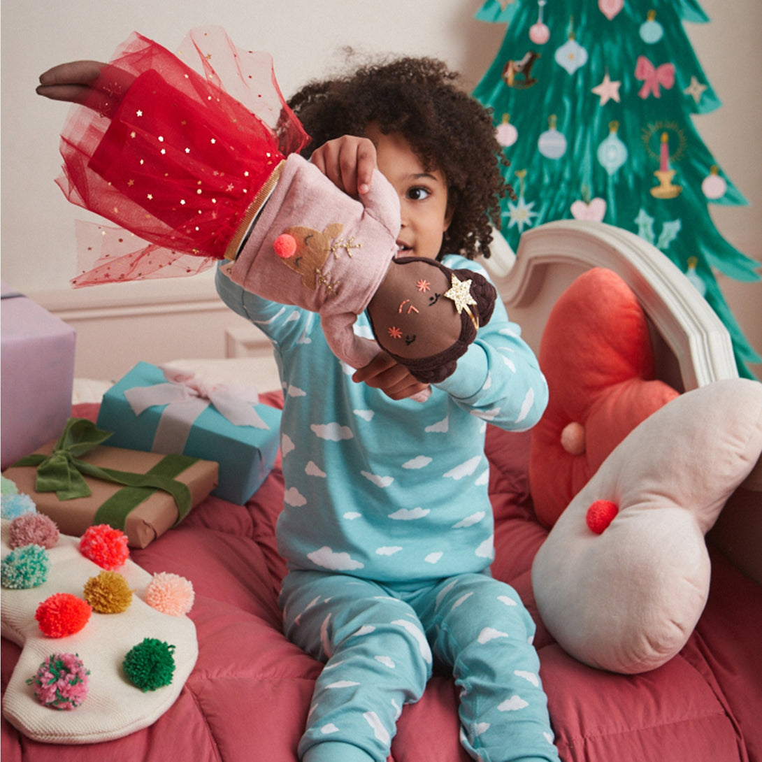 Our Christmas doll comes wearing wonderful doll clothing, including a reindeer sweatshirt.