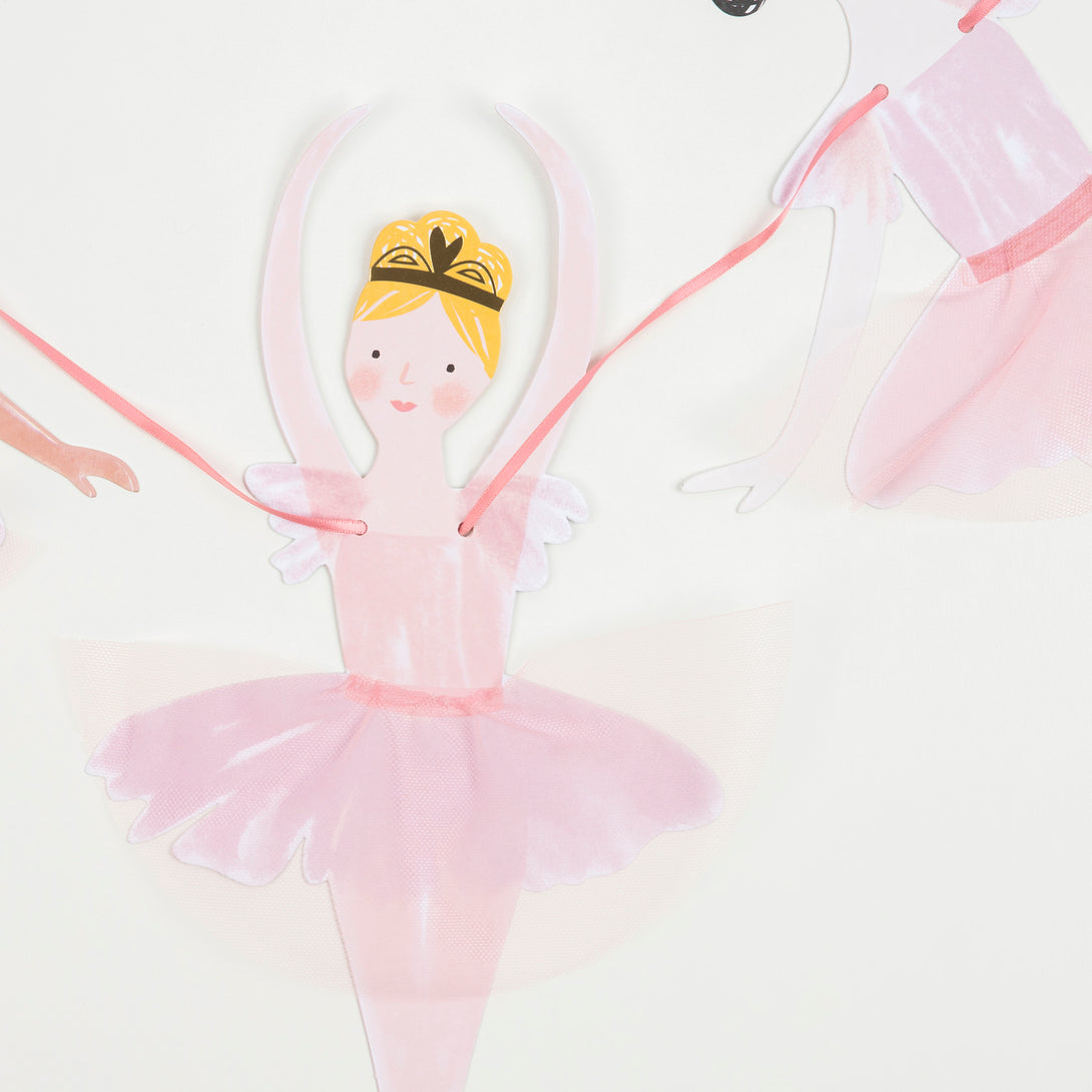 This set includes ballerina decorations for a birthday party, and tableware and a cupcake kit.