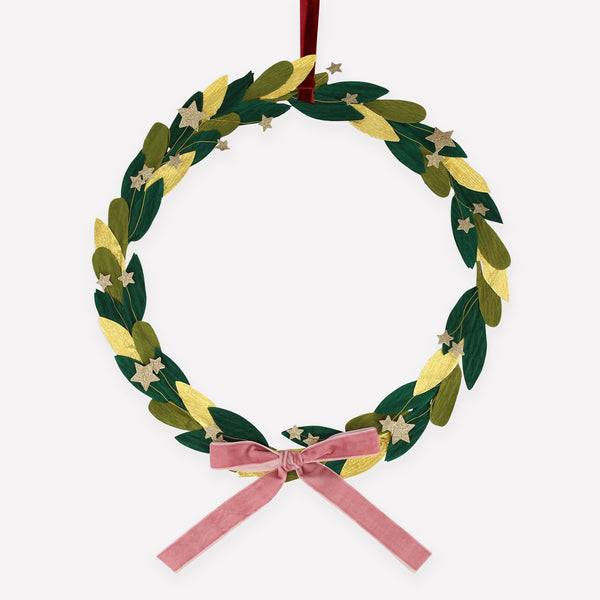 Our star wreath has gold glitter stars, paper leaves and a velvet ribbon and bow.