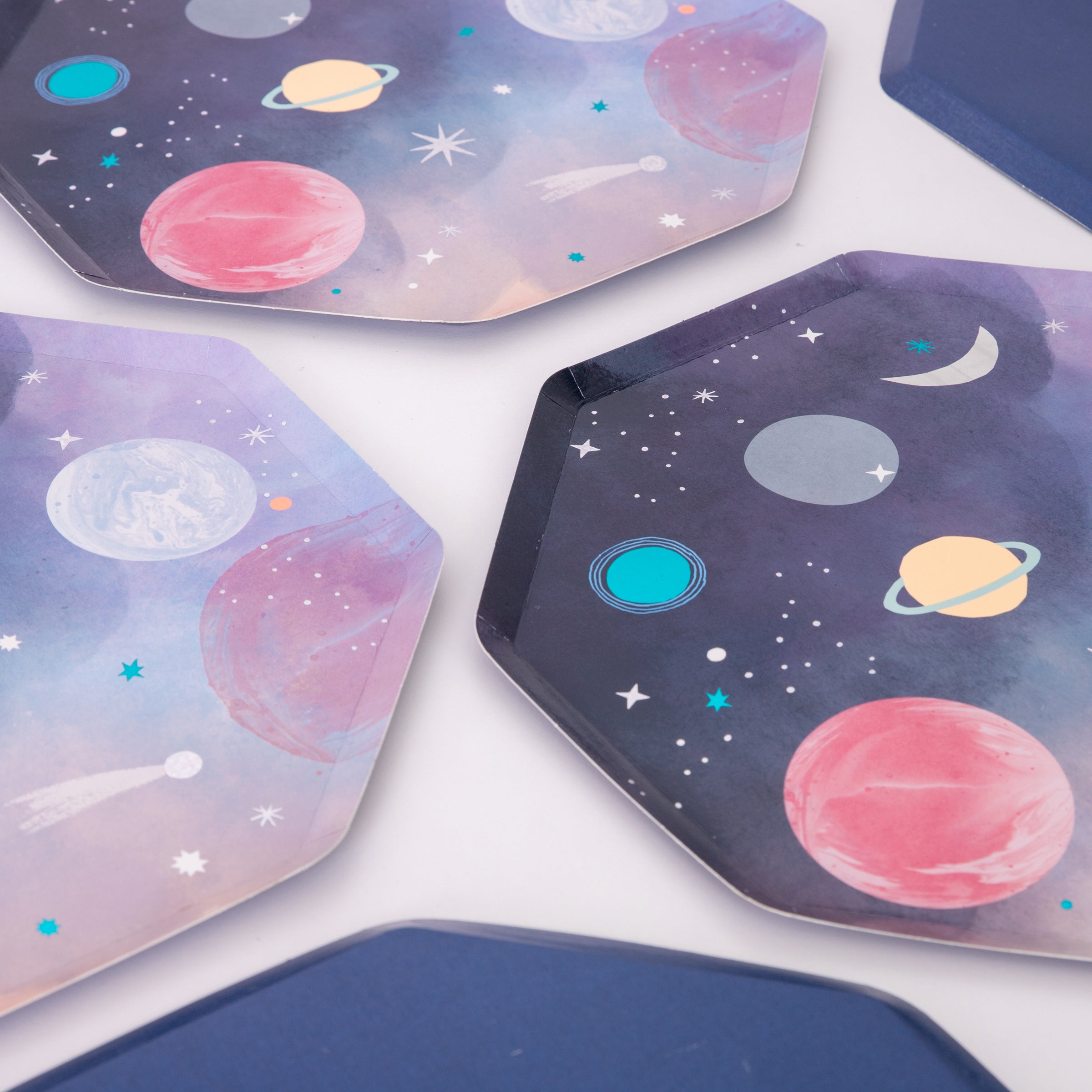 Our paper plates feature brightly colored planets and stars for an out-of-this world astronaut party.