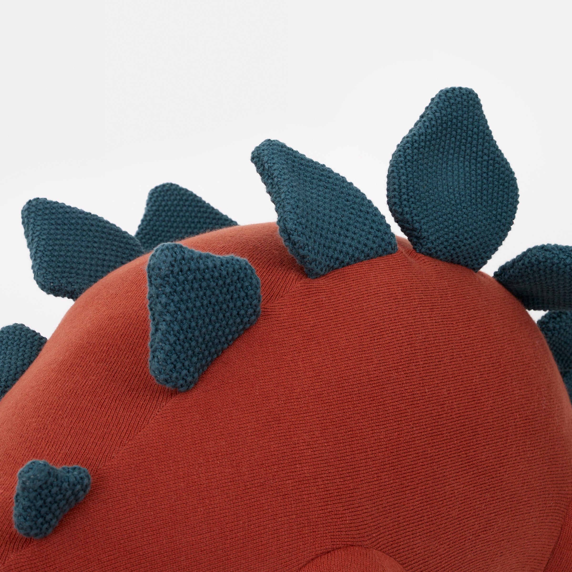 Bruce the stegosaurus toy is a fabulous kid's soft toy crafted from knitted organic cotton.