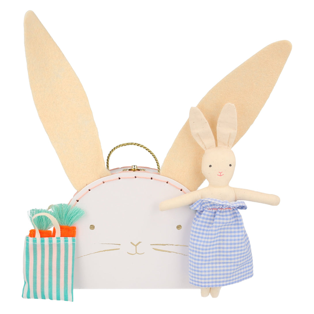 The bunny case opens to reveal an adorable mini bunny doll, with a striped tote bag and felt carrots.