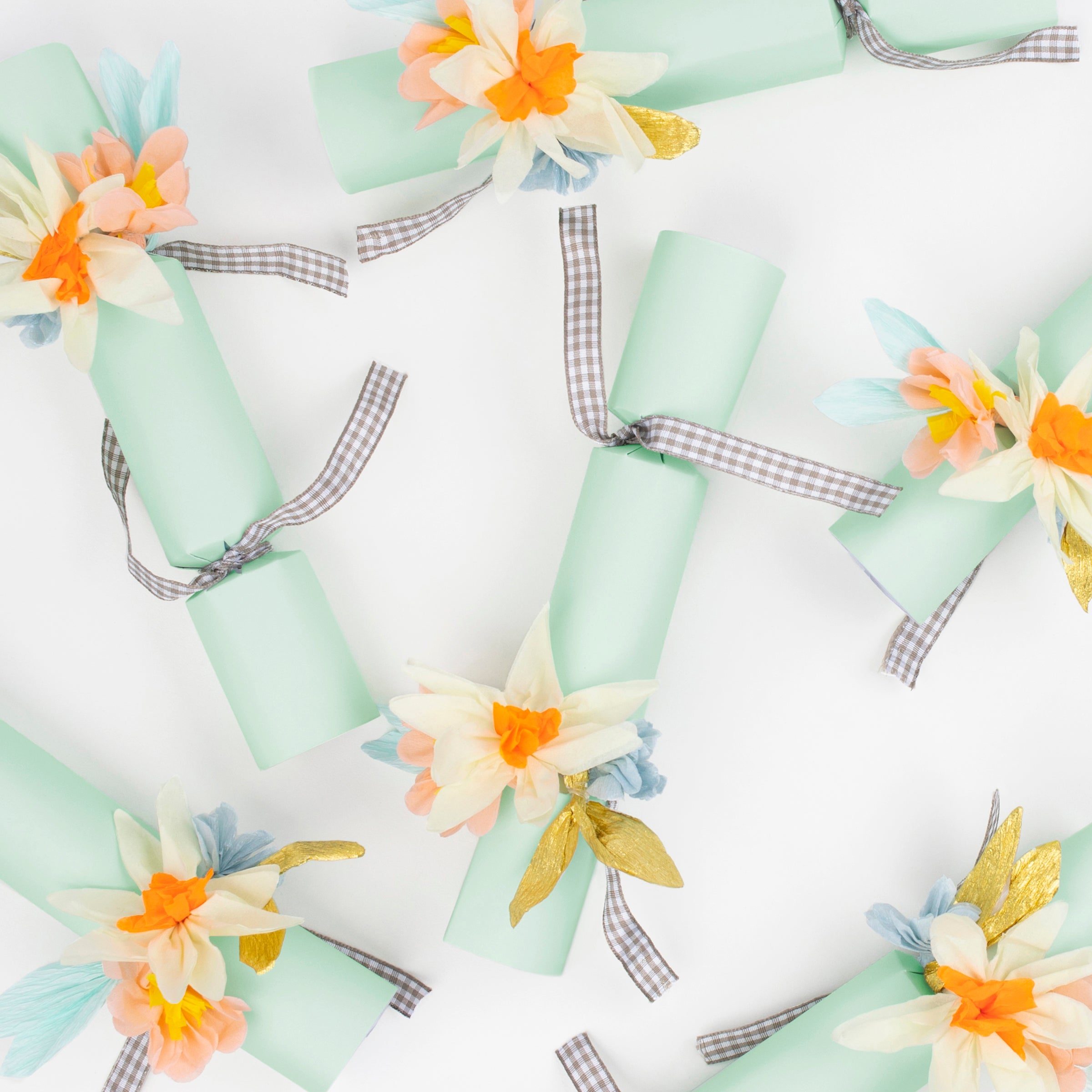 Our Easter crackers are decorated with beautiful crepe paper flowers and contain glitter flower brooches.