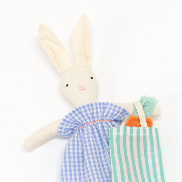 The bunny case opens to reveal an adorable mini bunny doll, with a striped tote bag and felt carrots. Image2